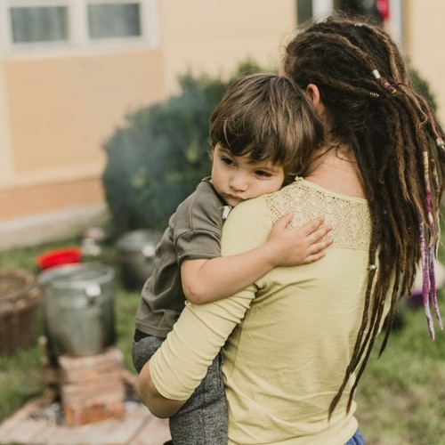 Image depicting a woman holding a child.
